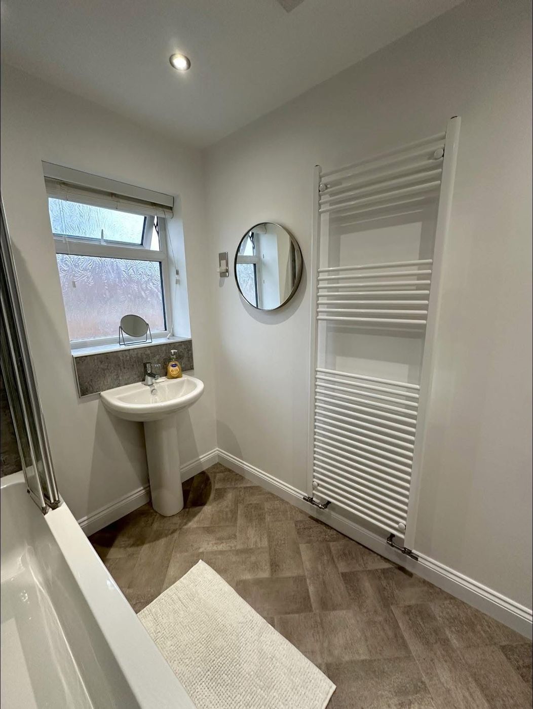 Bathroom with new towel rail and mirror fitted