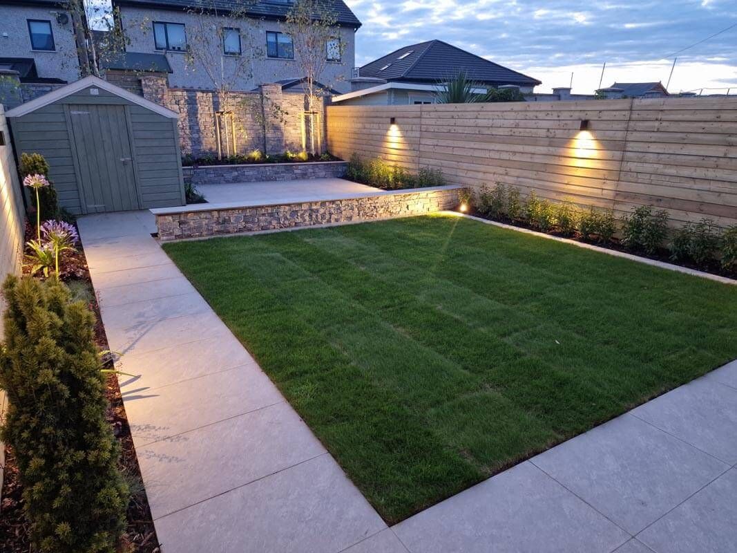 New turf lawn with patio and garden lighting